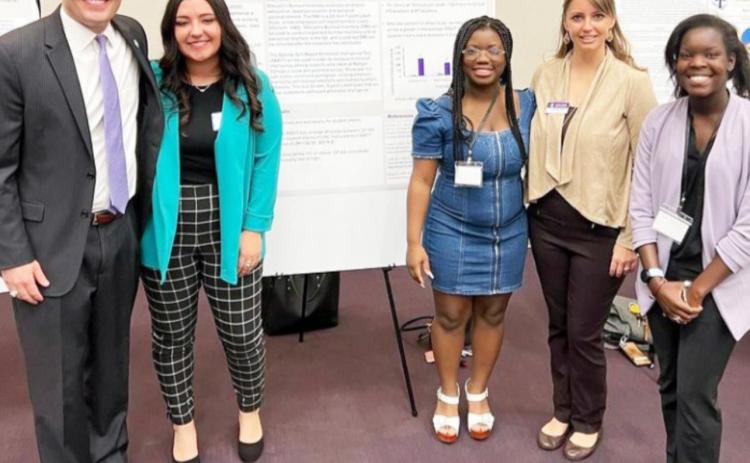 Dr. James Hurley, 16th President of Tarleton State; Rebecca De Los Santos, student researcher; Simone Dickson, student researcher; Dr. Jamie Borchardt, professor and faculty mentor; Bea Yousey, student researcher. Courtesy photo.