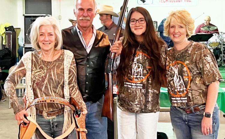 The winners of the special raffle at the 2021 Hunters Blowout Ball were Menardians Donna and Walter McAllister, left. Also pictured are Callie McSherry and Cherry Swindall with the Menard County Chamber of Commerce. The McAllister’s prize package included 2 Cimmaron P Model revolvers, 1 Cimmaron 1892 Lever-Action and a handmade full-rig leather holster made by Lance Hill of Menard’s Hill Leathercraft. TMN photo.