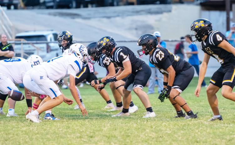 SITTIN’ ON GO- JV Jacket defense lines up against Eden in Menard’s win on Thursday, Oct. 15, 2026. The game was called in the second quarter due to lightning, with Menard up 16-0. Left to right: Brayden Ramon, Dawson Nicholas, Ashton Martin, Easton Sanchez, River Salas.