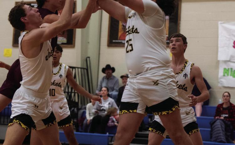 Freshman Ayden Ramon (25) and Senior Wyatt Terrell fight for the ball in Tuesday’s game against Bronte.