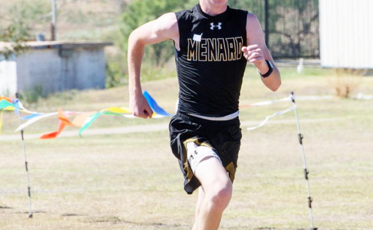 Freshman Bryce Davis, pictured left at the district cross country meet last week, was Menard’s top finisher at the regional contest on Tuesday. Davis placed 83 out of 135 runners. Photo by Nora Davis.