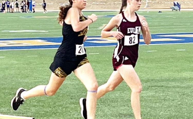 Freshman Kendal Lawler, left, strides past an opponent during the 3200m run at the Region II-A track meet in San Angelo on Saturday, April 30. Lawler placed 15th in her race. Courtesy photo.