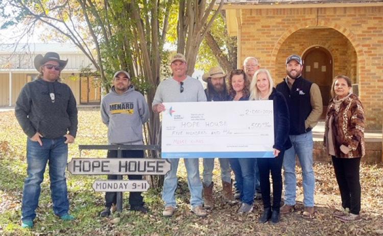 A DONATION FOR THE SEASON- Menard County Farm Bureau presented a donation check to the Hope House food pantry this week. Pictured left to right- Cody Swindall, Farm Bureau (FB); Hope House (HH) volunteer; Tyson Roll, FB; Charlie Goode, HH; Bobbie Jo Hartwick, HH; Bill Swope HH; Melanie Cruz, HH; Zach Nash, FB; Mary Chavez, HH. Courtesy photo.