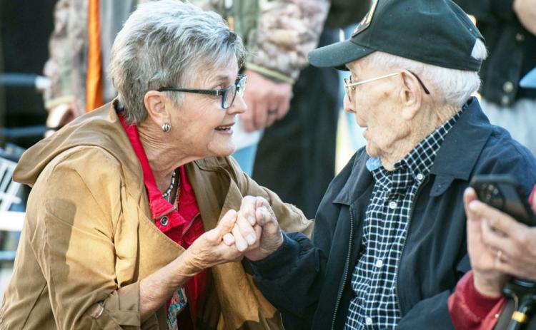 'THANK YOU.' Mrs. Dreu Bearden takes a minute to visit with WWII veteran Bill Potter in American Legion Park after Saturday's parade. See additional photos on page 8. Sandy Kothmann, photo.