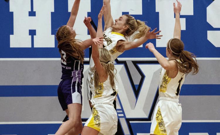 BELOW- Menard's Mackenzie Compton, center, works with Taytum Chambless and Makenzie Wright to deflect a Hornet shot during the Lady J's bi-district loss to Irion County, 24-48, eectively ending the girls' basketball season at San Angelo Lake View on Monday night. Nora Davis, photo.