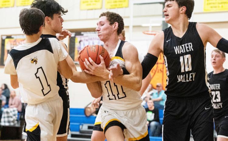 Senior Roy Brown (1), and junior Wyatt Terrell (11) fight for the ball in the Yellowjackets’ meet-up with Water Valley.