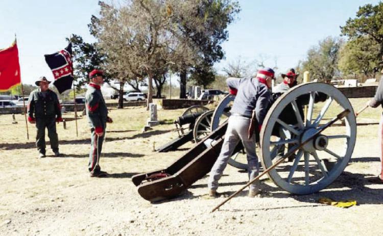Preparing the cannon at the 2022 Civil War veteran memorial program are Gary Bates, Buck Bostick, Danny Masters, and Wayne Carlile. The 6-pound cannon fired during the veteran recognition at Pioneer Rest Cemetery was originally used in the 1960 movie “The Alamo.” The canon will be included again at this year's remembrance on Saturday. Courtesy file photo.