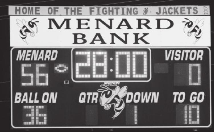 Left-The winning scoreboard shot! It’s been a while since the ‘Jackets racked up 56 points and shut out the opposing team! Photo by Nora Davis.