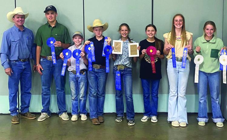Menard’s Wool and Mohair judging teams (l to r): Coach Jason Bannowsky, Cado Bannowsky, O’Dan Wright, Kade Bannowsky, Channing Chambless, Kate Baker, Mackenzie Wright, and Taytum Chambless. Courtesy photo.