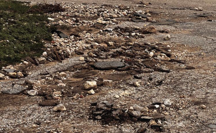 Road debris, as pictured above on Wilkinson Street, can be found on many streets throughout town. A city bond election held in 2019 — which proposed to chip and sealcoat all city streets, improve drainage systems, and make other street-related improvements within the city limits — failed to pass. City road crews will be working to repair streets, as soon as, weather allows. TMN photo.