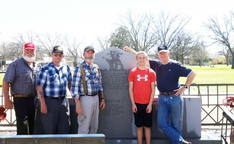 Members of Menard's Sons of Confederate Veterans (SCV) Camp 2326 cleaned the veteran monuments at American Legion Park earlier this year. Pictured left to right: Barry Kniffen, Eddie Bostwick, Gary Bates and grandson Seth Bates, and Terry Kelley. The local SCV is one of several organizations who readily take part in preserving the history of Menard County veterans by maintaining memorials and cemeteries, holding ceremonies, and marching in the annual PTO Veterans Day Parade each November. Courtesy photo.