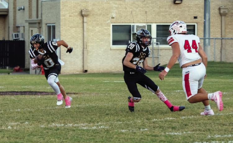 'I'LL TAKE THAT' says junior Hunter Squiers (#0) after nabbing his fourth interception of the season in Menard's 59-0 district win over Leakey last week. Senior Bryce Davis (#20) provides a block. The Jackets are now focused on Medina, where they will be on the road this Friday. See additional football photos thanks to our Jacket Backers on page 8. Nora Davis, photo.
