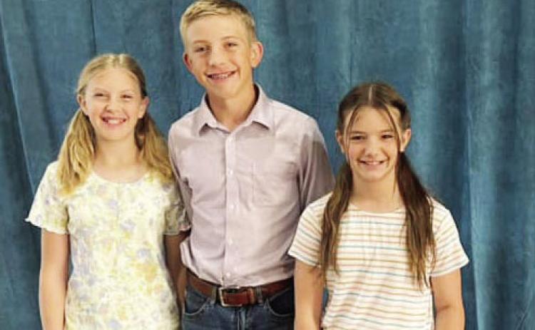 ABOVE- Caitlyn Burch, Benjamin Burch, Claire Corbin.