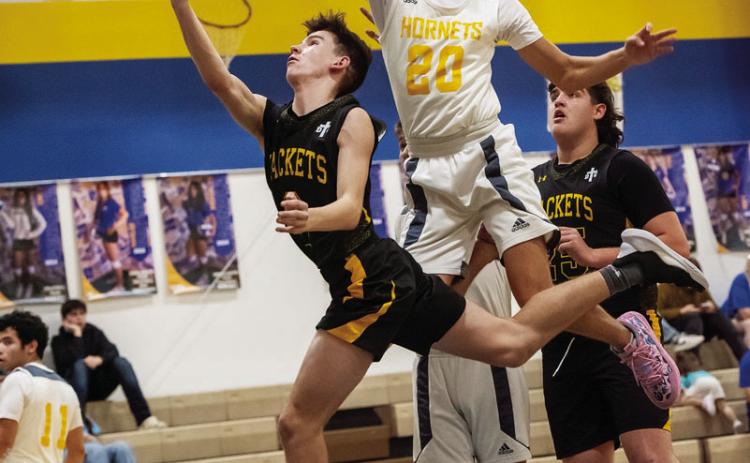 ABOVE- Menard’s Eli Weatherly works his way through the Rochelle defense during the Jackets’ district win on the road last week. Next up for the Jackets is the bidistrict round of playoffs, to be played early next week. Nora Davis, photo.