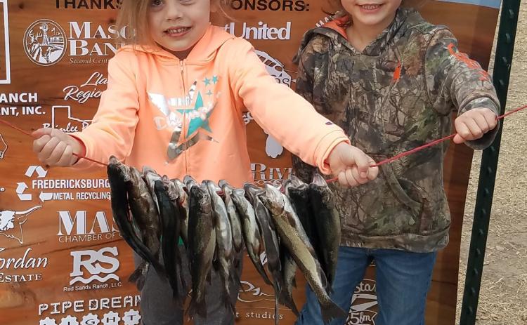 A pair of very excited young fisherwomen with their bounty thanks to a WinterFisch event. Courtesy photo.
