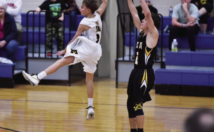 ABOVE- Freshman JV Jacket Jaegar Leonard leaps to intercept a Paint Rock pass at a home game this past Tuesday. Madolyn Nasworthy, photo.