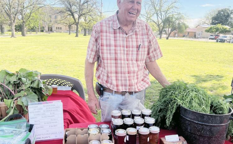 Market vendor Billy Kniffen with his BMK Farms wares of fresh veggies and homemade jams.