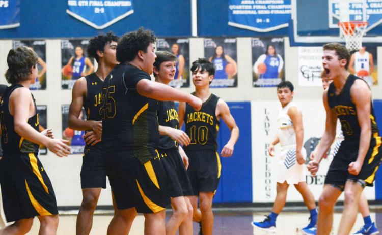 TEAMWORK- Yellowjackets celebrate in their win over Eden on Tuesday night. Left to right: Kade Rayburn, Isaiah Stanislawski, Zadrian Zapata, Roy Brown, Orlando Resendiz, and Joel Guerrero. Sandy Kothmann, photo.