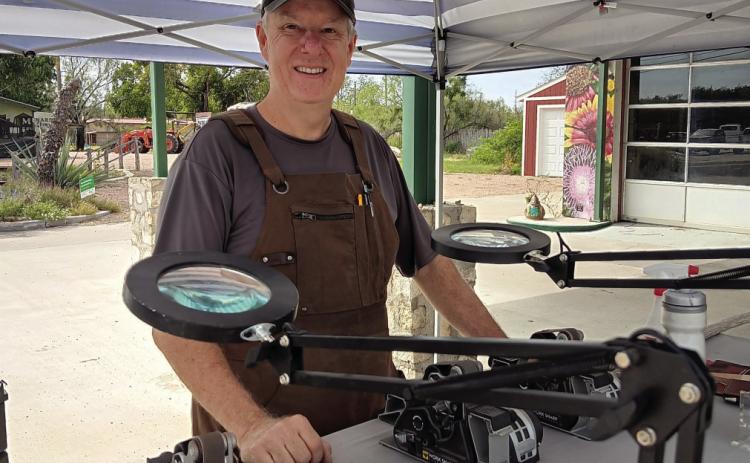 Mark Wilson’s Wilson Sharpening Services “pops-up” in front of The Menard Station. Look for the blue and white striped tent. Courtesy Photo.