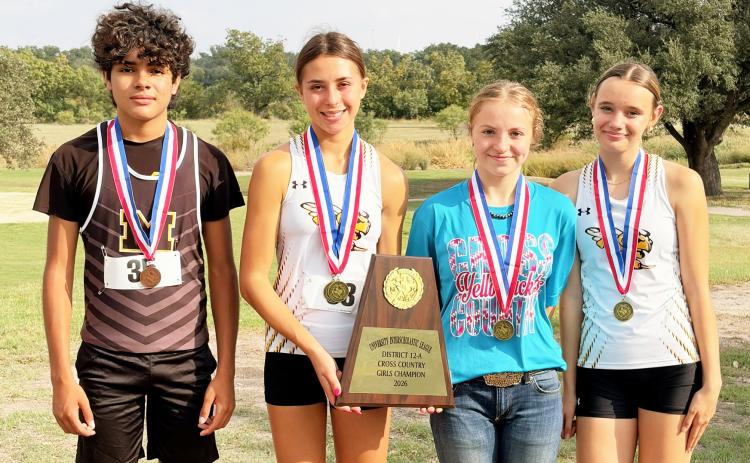Ian Brown, Danni Ruiz, Isabelle Devine and Aerie Meddaugh display the high school cross country’s hardware from Wednesday district meet in Eden. The group photo is sparse due to half of the athletes leaving quickly after the race to attend the Hill County Youth Commercial Heifer Show as contestants. Laressa Brown, photo.