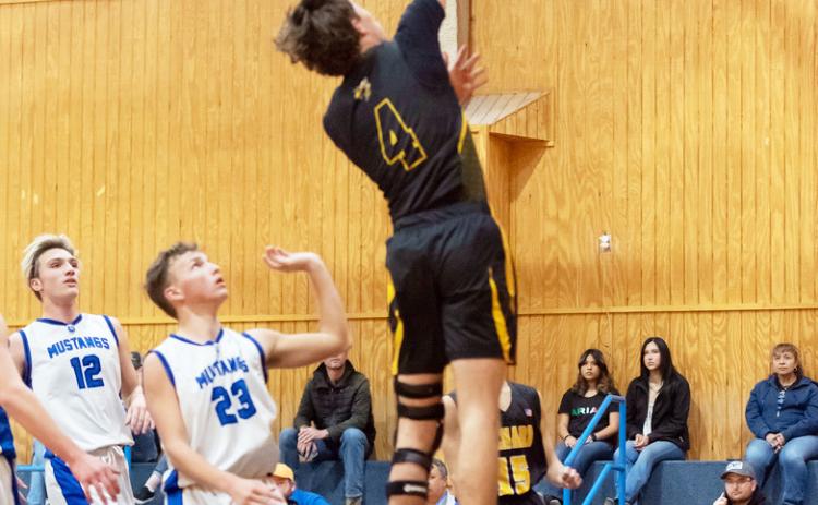 LEFT- Menard senior Colby Powell gets the bucket in a regular season game against Olfen this season. The Jackets are primed to be distrcit champions and will officially secire that title with a win against Rochelle on Friday, Feb. 7. Nora Davis, Photo.