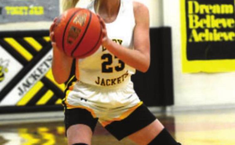 Freshman Korah Mayfi eld looks for an open man in the fast paced game against 2A San Saba.