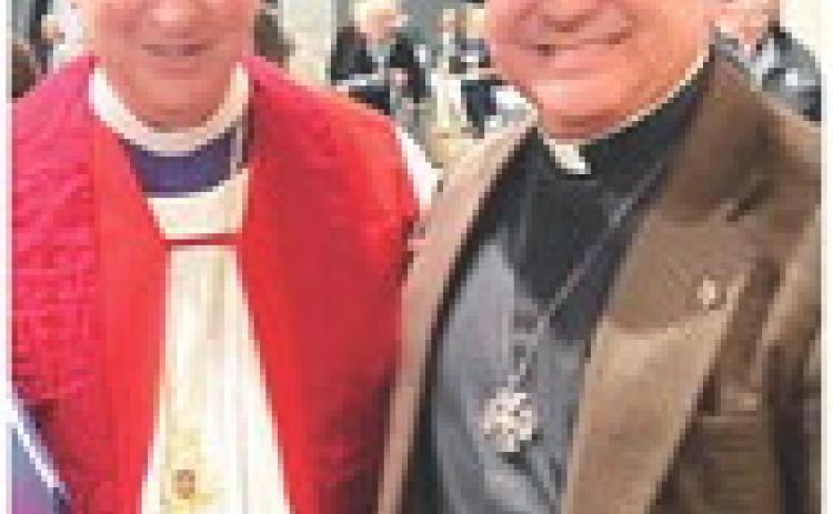 Rev. Reed, left; Father Roque, right.