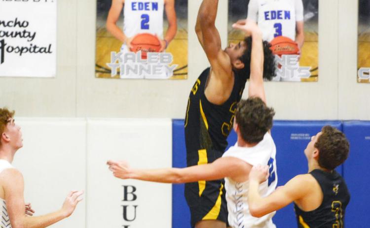 Menard junior Isaiah Stanislawski receives a pat on the head from an Eden defender during the Yellowjacket win over the Bulldogs last Tuesday, February 1. Teammate Joel Guerrero awaits the rebound. The Jackets pounded Paint Rock 55-30 this week, and will face Veribest on Friday, February 11, in Veribest. Sandy Kothmann, photo.