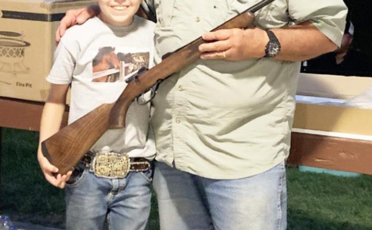 O’Dan Wright, left, poses with prize-winner James Lafosse. Lafosse won the 6.5 Grendel CZ and promptly donated it back to auction where O’Dan was able to “buy” it. TMN photo.