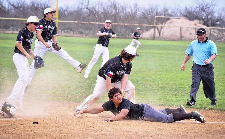 YOU'RE OUTTA HERE! Madolyn Nasworthy captured this great shot of Yellowjacket Jadon Torres, center, as he tags out a Brady JV runner trying to steal third during a Ranch Ball Tournament match-up in Menard last weekend. Jacket teammates Kade Rayburn, Jay Guerrero, Tate Wagner, and Hunter Whitaker celebrate the play as umpire David Sanchez moves in to confirm.
