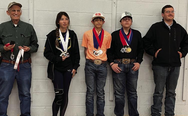 Heart of Texas Indoor Match participants and coaches sporting their newly earned hardware (l to r)– Coach David Hand; Mia Estrada; Mason Mireles; Dawson Nicholas; and Assistant Coach and Texas State Games Champion Larkin Loeffler. Courtesy Photo.