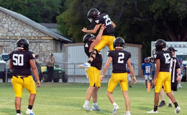 Varsity Jackets celebrate a good play during last week's scrimmage against Gorman. Pictured left to right: Zeke Hernandez, Tate Wagner, Colby Powell, Logan Powell, Jayden Payton. Menard travels to Blanket Friday night. JV will host Blanket here at home on Thursday at 6:00. Nora Davis photo.