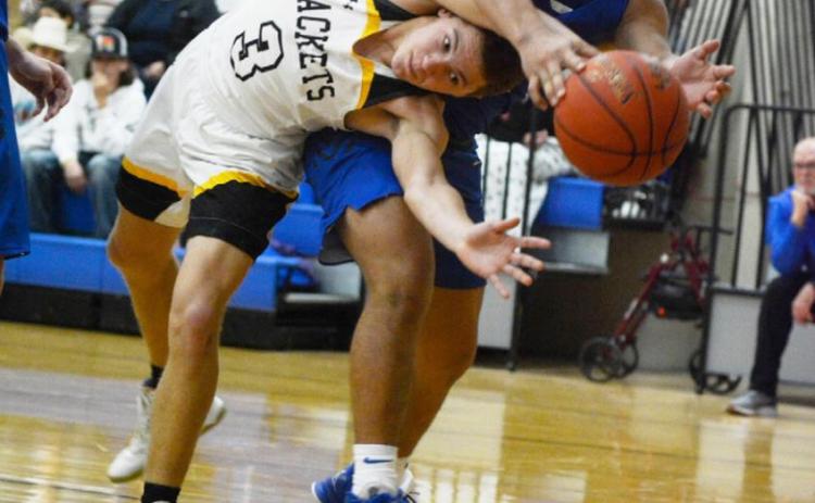 ABOVE- Joel Guerrero practices a complicated yoga pose as he fights for the ball against Eden.