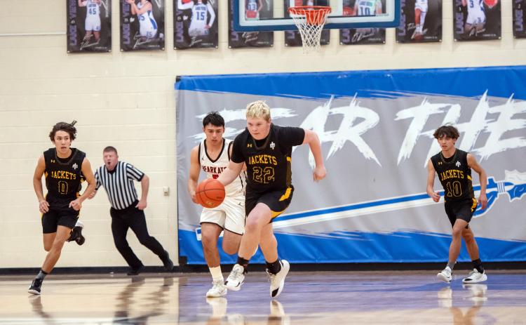 LAST SWARM DOWN THE COURT for senior Tate Wagner, center. Marlee Salas and Julius Zamora follow Wagner back to offense during the Jackets' 31-60 bi-district loss to Garden City on Tuesday. Menard boys will lose 3 players to graduation this year: Tate Wagner, Jaegar Leonard and Bryce Davis. Nora Davis photo.