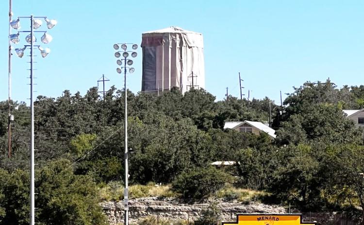 THIS ICON IS GETTING A MAKEOVER- The city's water tower is seen draped in heavy tarps while crews deal with removing lead paint in the process of refurbishing the structure. The project is part of a multi-million dollar partially grant funded upgrade to the City's public water system. TMN photo.