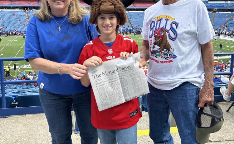 Benny Fred and Cordelia Kothmann recently took grandson George Corbin, center, to a Buffalo Bills football game in New York. George’s mom Valera (Kothmann) Corbin also attended, and of course they dutifully brought along a copy of The Menard News. Cordelia reports TMN was also taken internationally into Canada; however, they were having so much fun they forgot to get a photo. Thanks for including us, Kothmanns and Corbins!