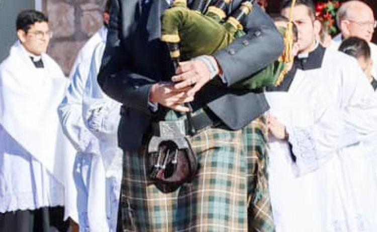 ABOVE- A bagpipe-led processional traveled a block from downtown San Saba Ave. to the historic original Catholic church which was recently renovated.