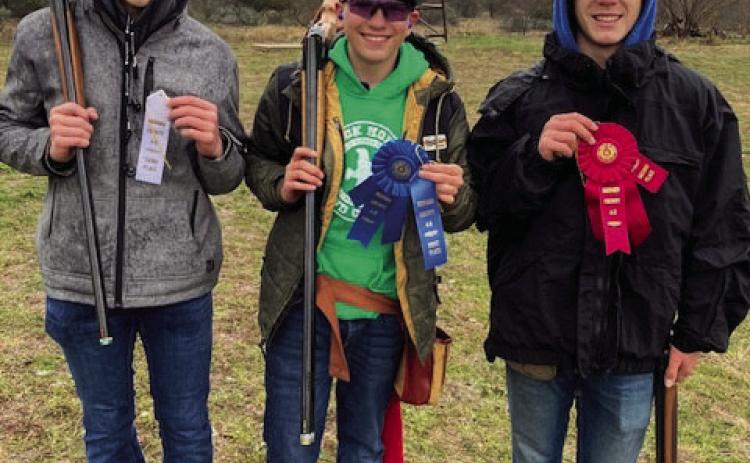 Three scatter shooters participate in Menard 4-H Shotgun Sports County Club shoot