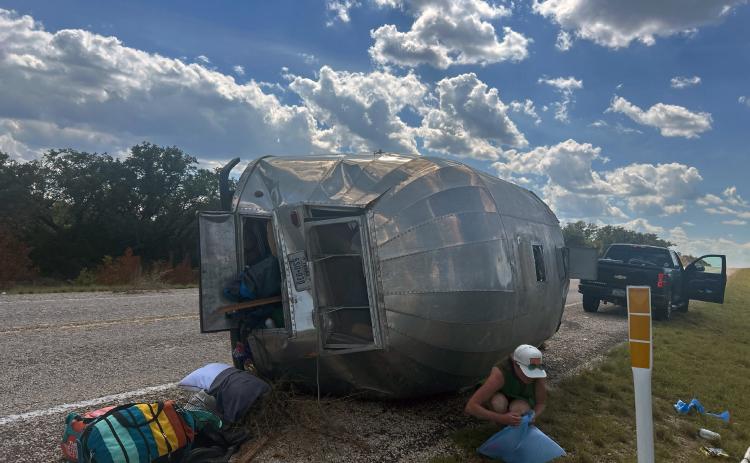 It was a sunny Tuesday afternoon this week when a pickup pulling a camping trailer unhitched from the vehicle and flipped onto its side. Preliminary consideration suggests the rig was traveling too fast downhill on SH 29 about 6 miles east of Menard. The vehicle and its two occupants were unharmed. Traffic was briefly interrupted only when the tow truck loaded the trailer. MCSO photo.