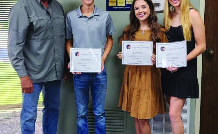 MENARD BANK SCHOLARSHIP RECIPEINETS- pictured with Menard Bank President Monte Lyckman (l to r) Roy Brown, Aminy Anderson, and Addy Bannowsky.