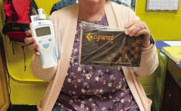 School nurse Norma Hitt displays the thermometer and otoscope Frontera Healthcare employees recently donated, reinforcing the clinic's commitment to supporting local communities and improving access to essential healthcare resources. TMN photo.