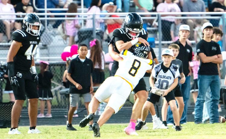 Mack Davis jumps on a Water Valley ballcarrier in Menard’s big 65-37 district opening win on Friday, Oct. 9.