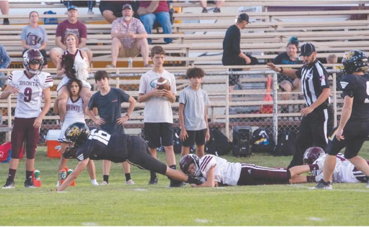 ONE. MORE. YARD. Is what senior John Michael Eggleston (16) was reaching for last Friday during the Yellowjackets' homecoming win against Bronte. Senior Hunter Whitaker (9) checks in at the end of the trail of Longhorns left in Eggleston's wake. Nora Davis, photo.