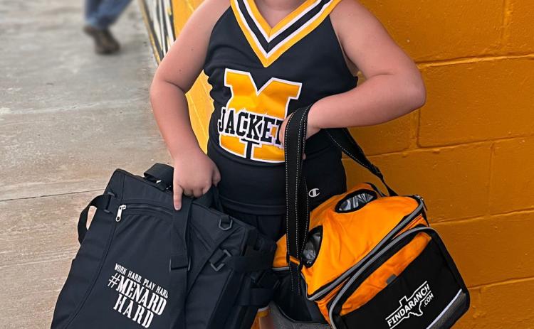 Ms. Harper Butch was the big winner of the News' prize pile giveaway at Friday's Meet the Jackets. Harper walked away with a handful of loot from Sumerland Public House, Los Abuelos, Hill Leathercraft, and FINDARANCH.com. Harper, a mini-cheerleader who performed Friday evening, is the daughter of Yancy Butch and Chelsea Nicholas. TMN photo.