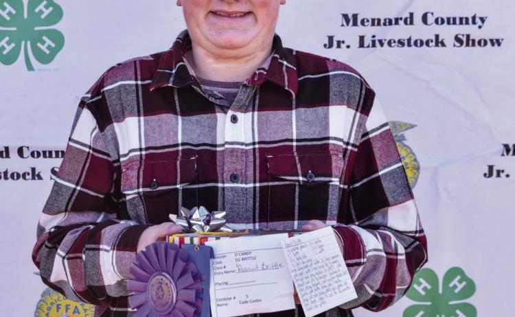 LEFT- At the 2022 county show Cade Corbin won several ribbons for his food entries. That effort translated to the sale, earning Cade a few hundred dollars for his college savings account thanks to generous donors. Madolyn Nasworthy, photo.