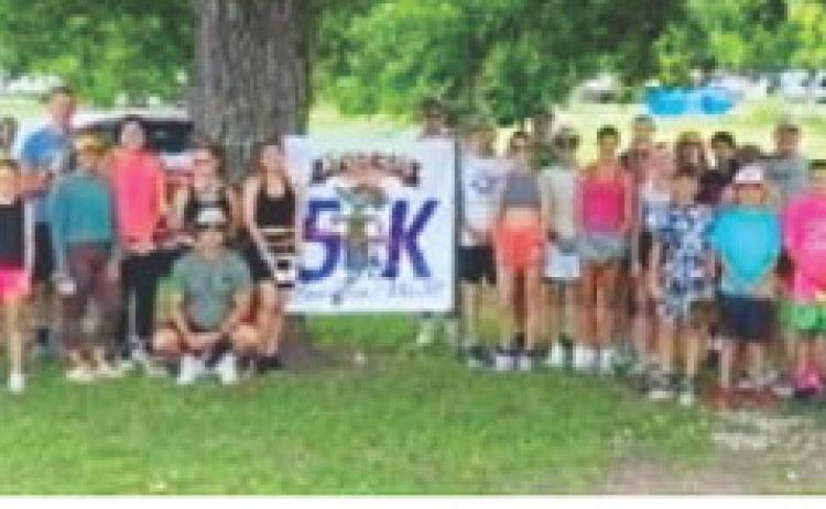 JIM BOWIE DAY 5K participants and volunteers gathered for a group photo on Saturday, June 13, 2026. Courtesy photo.