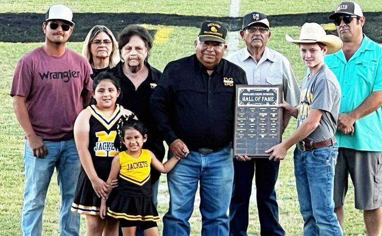 Anastacio 'Butch' Aguilar, center, was inducted into the MHS Hall of Fame last Friday prior to the homecoming football game in Menard. Butch and his wife Glenda are enjoying retirement in Menard. Joining them Friday was (left to right): Anthony Garza, Bea Garza, Glenda and Butch Aguilar, Buddy Garza, MHS student council representative Kade Bannowsky, John Mireles. Front: Hunter Mireles and Charleigh Jo Sue Aguilar. Read more about Butch on page 3. Courtesy photo.