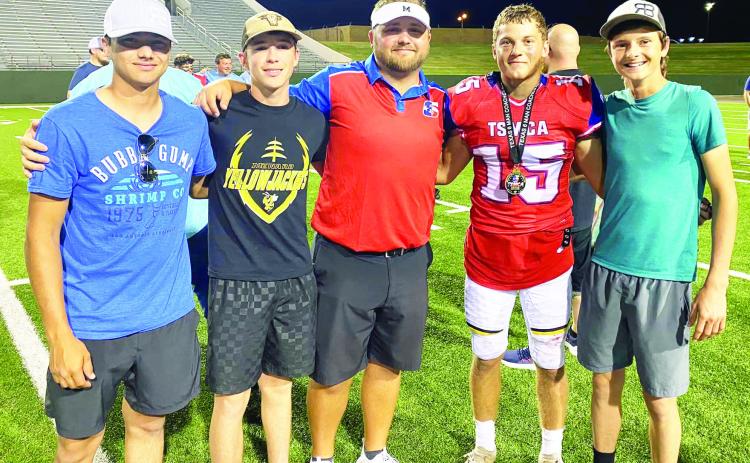 PRIDE NEVER DIES- Left to right is former Yellowjacket Kolton Whitaker, Yellowjacket Logan Powell, coach Bryson Oliver, Joel Guerrero, and former Yellowjacket Roy Brown to celebrate Oliver and Guerrero after the TSMCA All-Star football game on Saturday, July 1. Courtesy photo.
