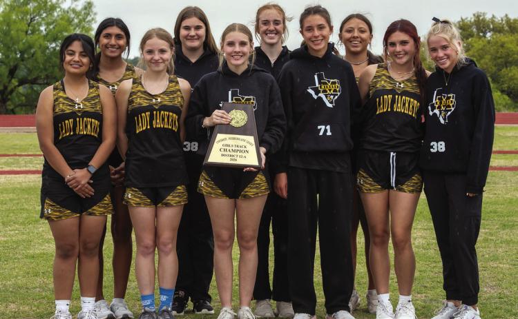 LADY JACKETS ARE DISTRICT CHAMPS ONCE AGAIN in track and field. Pictured front row, left to right: Monserrat Gonzales, Isabelle Devine, Caitlyn Whitaker, Danni Ruiz, Sabri Zamora, Taytum Chambless. Back: Aubree Hernandez, Kylee Sommerville, Makenzie Wright, Perla Pecina. Nora Davis, photo.