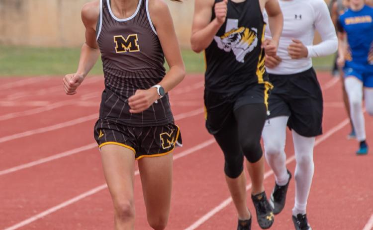 SEE YA- Freshman Lady Jacket Danni Ruiz, pictured left at the Blanket Tiger Relays earlier this season, often ran the 800m at invitational meets with the boys division. Her time applied to the girls race, but running with the boys helped her keep a more consistent, competitive pace. Going into the regional meet this weekend, Danni holds the the second quickest 1A 800m time in the state, along with the fastest (by almost 2 seconds!) 400m time. Nora Davis, photo.